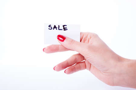 Woman hand holding a white card on white background, saleの写真素材