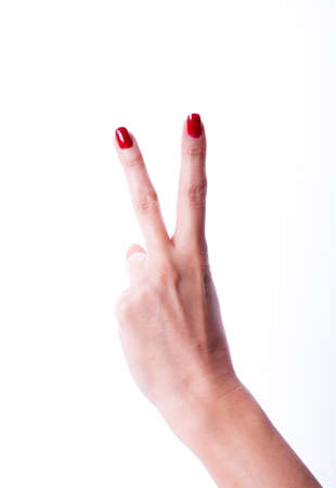 Beautiful woman hand holding items isolated on white backgroundの写真素材