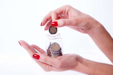 Woman hand showing an euro coin isolated on a white background