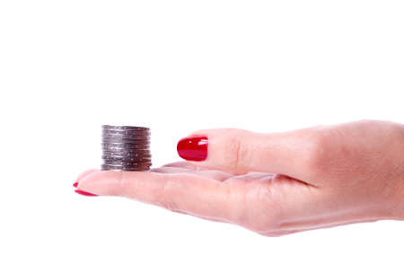 Woman hand showing an euro coin isolated on a white backgroundの写真素材