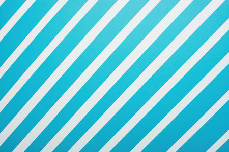 White diagonal stripes are creating a dynamic pattern on a vibrant blue background, offering a simple yet visually appealing designの素材