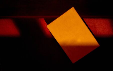 empty wooden plank plate in night light with red . High quality photoの写真素材