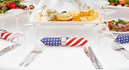 Catering. A serving table, ready for the arrival of guests. Stylized as USA. With American flag...