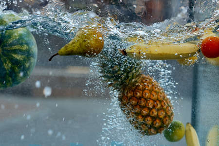 delicious vegetables and fruits were thrown into the water. Shooting in the aquariumの写真素材