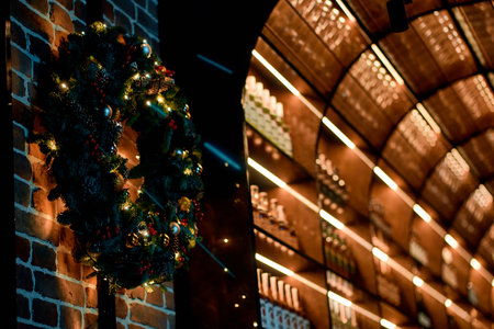 Festive Christmas Wreath and Illuminated Shelves.の写真素材