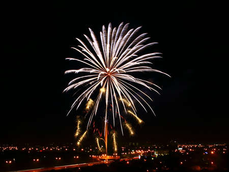 Fireworks, fireworks close-up, launched from a pedestrian bridge across the road. In honor of the...
