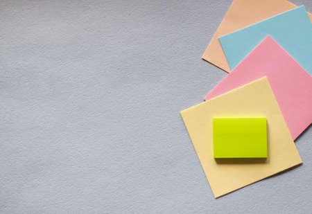 Colored sticky notes on a light background. The view from the top. Space for text. Horizontal photosの写真素材