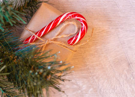 Gifts for the family. Beautiful gifts under the tree. New years interior. Christmas tree, happy holidays. Christmas gift box. On light background. The view from the top. Space for text.の写真素材