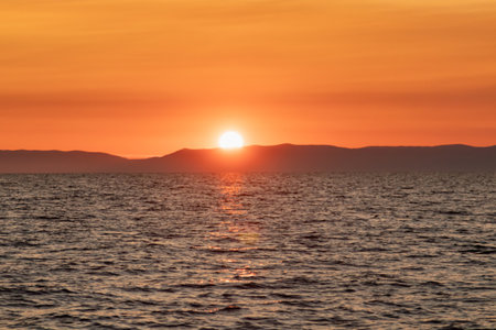 Fantastic sunset sun over Lake Baikal, summer time. Russia, Lake Baikal, Olkhon Island. High quality photoの写真素材