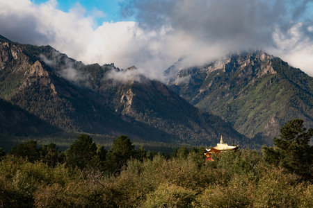 Barguzinskaya Valley, Buryatia, Russia - August 2024: Datsun is the palace of the goddess Yanzhima on a clear summer day. The roof of the palace is surrounded by mountains. High quality photoの写真素材