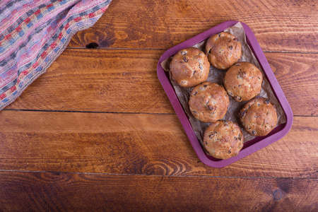 muffins with raisins on wooden backgroundの写真素材