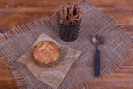 muffins with raisins on wooden backgroundの写真素材