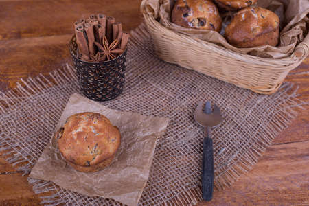 muffins with raisins on wooden backgroundの写真素材