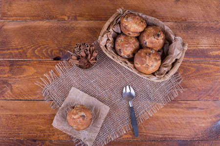 muffins with raisins on wooden backgroundの写真素材