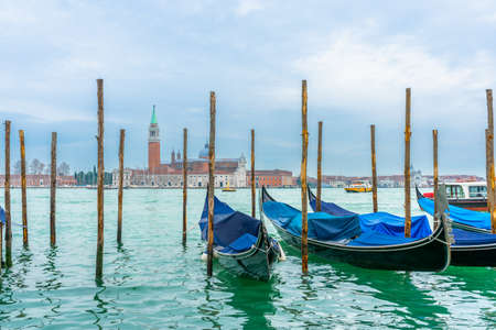 Gondolas and San Giorgio Maggiore church in Venice, Italyの写真素材