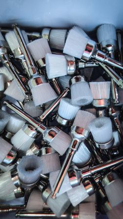 Vertical macro close-up photo of dental polishing brushes in dentistry, arranged in a fanned composition. Suitable for dental education, clinical materials, cosmetic dentistry, and marketing illustrations.の写真素材