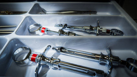 Horizontal photo of dental carpule syringes for anesthesia stored in white drawer organizerの写真素材