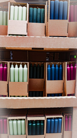 Sets of candles in cardboard packaging for cozy interior decorの写真素材