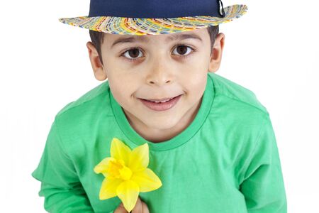 Young boy with a daffodilの写真素材