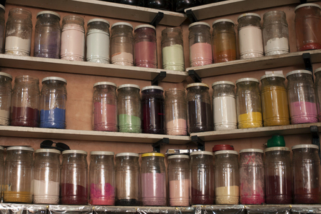 Shop shelves with a lot of jars with paint powder at Moroccoの写真素材