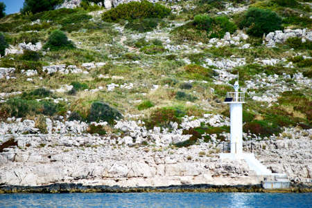 lighthouse on the rocks in Croatian islandsの写真素材