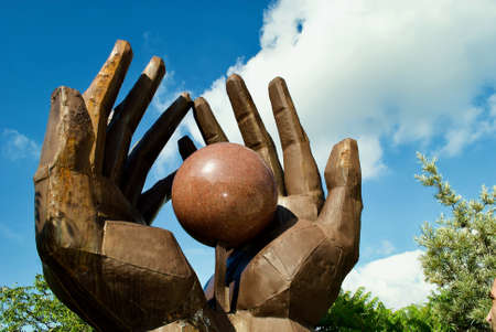 ball into big metal handsのeditorial素材