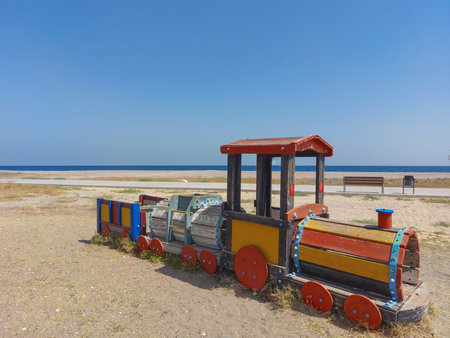 Wooden toy train on the beach in Kolobrzeg, Polandの写真素材