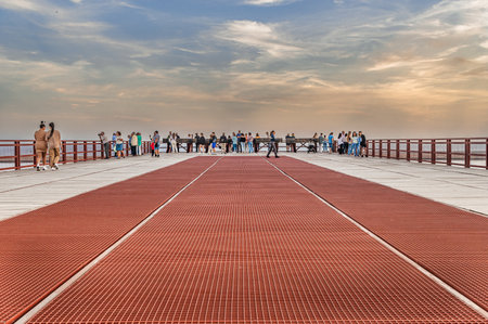 People walking on the pier in Barcelona, Spain