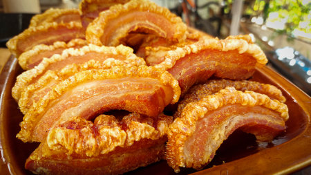 Crispy fried pork belly on a plate in the market.の写真素材