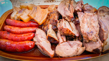 Sausages and meat on a plate, closeup of photoの写真素材