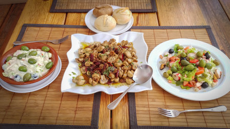 Greek salad with olives, feta cheese, olives and bread