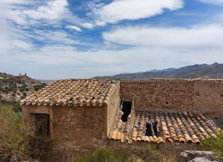 Roofs of an old house in a village in the mountainsの写真素材
