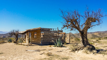 Old abandoned wooden house in the middle of the desert in California, USAの写真素材