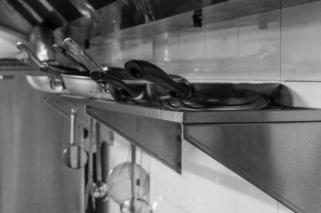 Stainless steel pans in the kitchen. Black and white.の写真素材