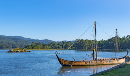 Traditional wooden boat on the bank of a river