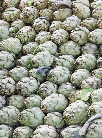 Background of artichokes at street marketの写真素材