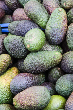 Background of avocados at street market