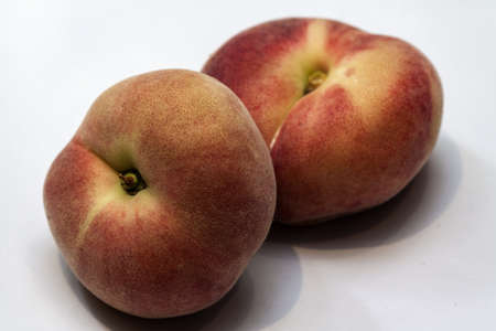 Image of two saturn  peaches isolatedの写真素材