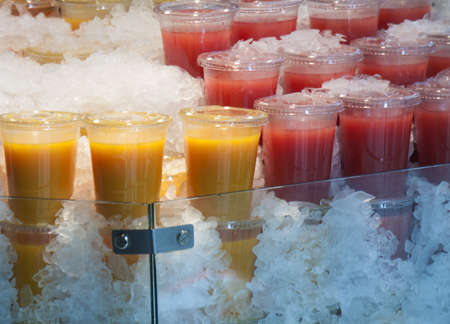 Image of some fruit juice cupsの写真素材