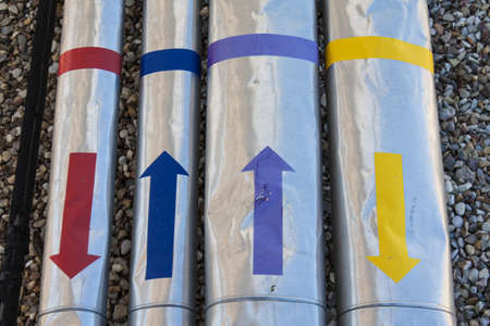 Image of pipes with colored arrows
