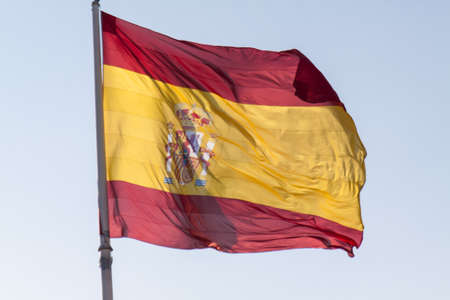 Spanish Flag blowing in the windの写真素材