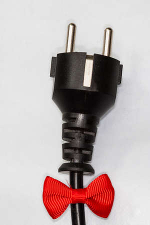 Electric Plug with ribbon isolated on whiteの写真素材
