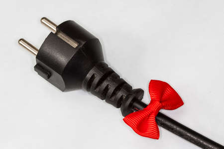 Electric Plug with ribbon isolated on whiteの写真素材