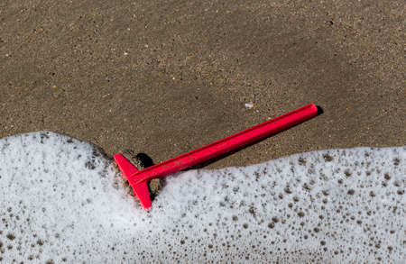 Children's digging toys in the sand at the beach