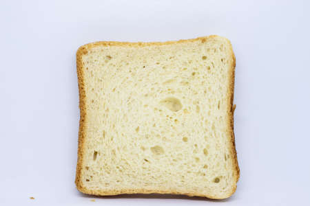 One slice of bread isolated on white backgroundの写真素材