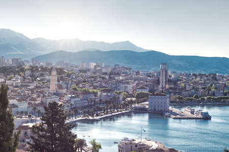 Town of Split, Croatia seen from the Marjan hill. Early morning sun peeking over the mountains on a cold day, distant mountains blurred in the fog.のeditorial素材