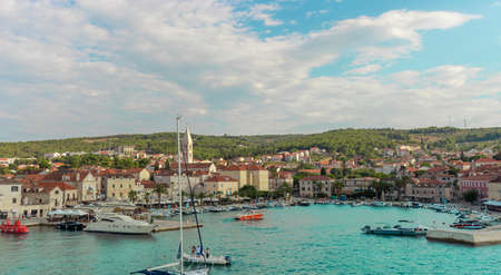 Supetar Croatia August 2020 Beautiful picturesque view of the town of Supetar, as seen from the car ferry from up high. Warm summer day on the small coastal town on the island of Bracのeditorial素材