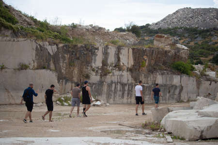Selca, Croatia August 2020 Group of friends walking through an abandoned stone quarry on the island of brac, croatiaのeditorial素材