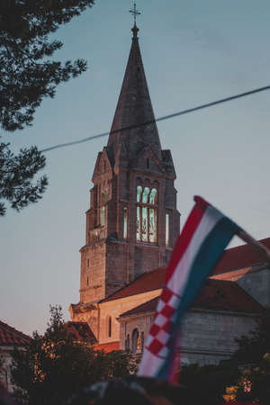 Beautiful top of the belltower of an old church in the village of Selca , on the island of Brac in...