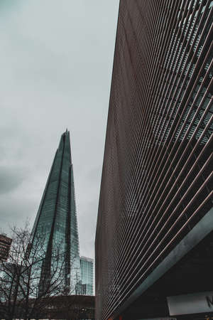 London UK January 2021 Vertical shot of the Shard megatower in London city, Moore street area.Dark cold moody winter dayのeditorial素材